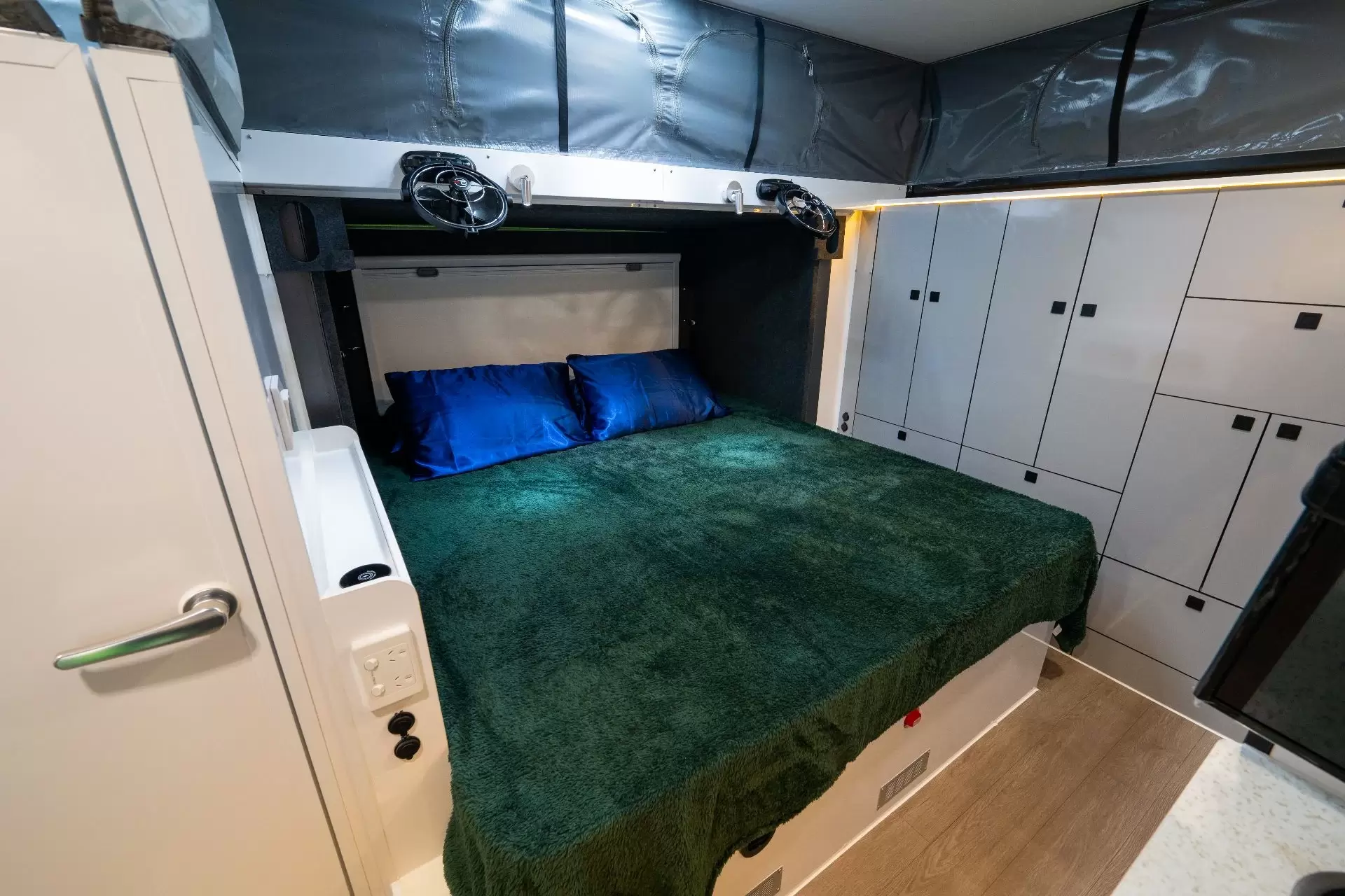 Frost 15 S interior with the bed and flexible pop-top roof surround visible