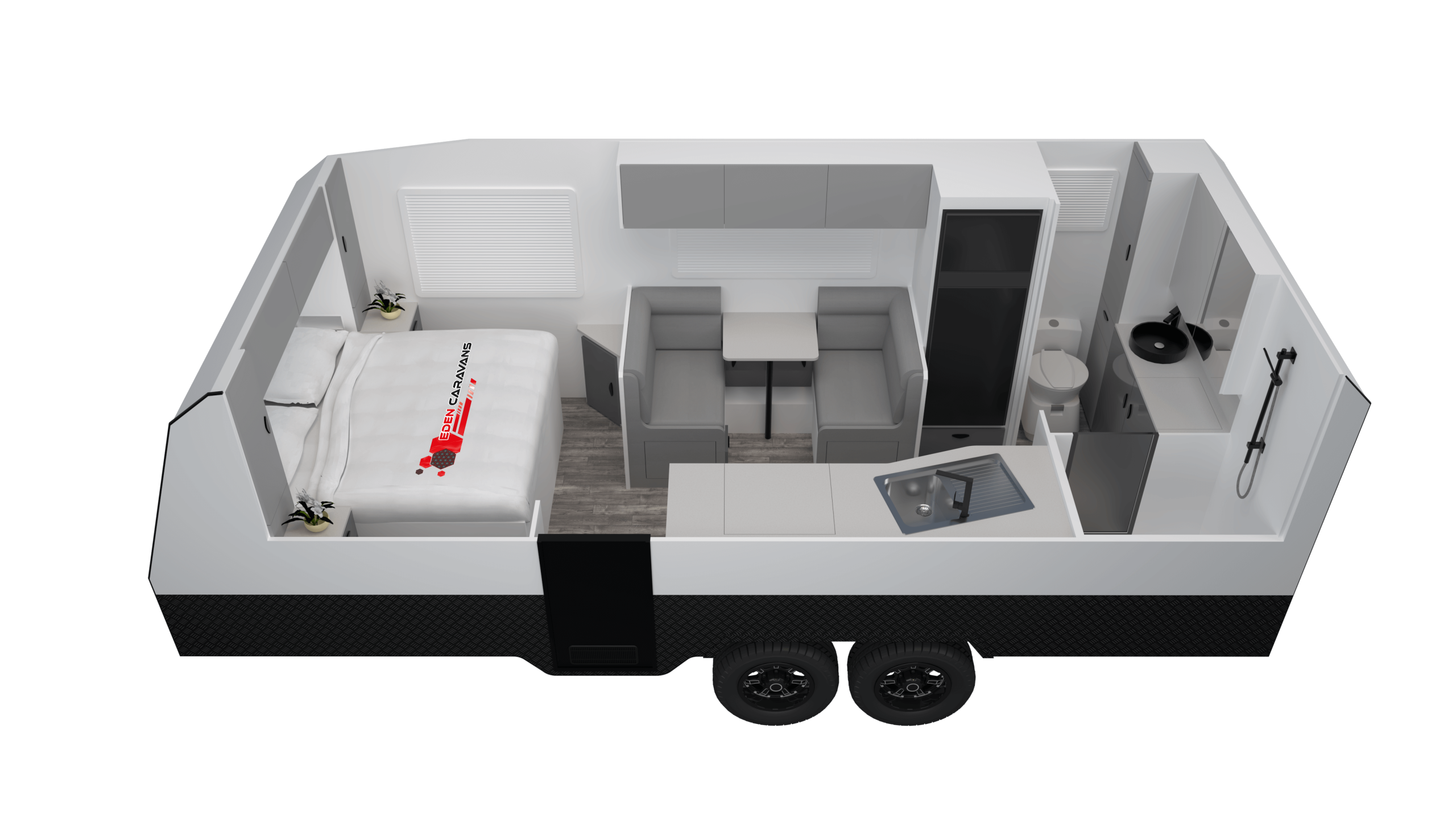 Eden Caravans Wildtrax floorplan showing front island double bed with side storage, central dinette with opposing lounges, rear kitchen bench with sink, and separate rear bathroom with toilet, vanity and shower